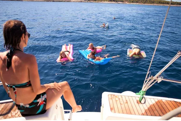 Guests swimming from the boat in the bay of Agadir